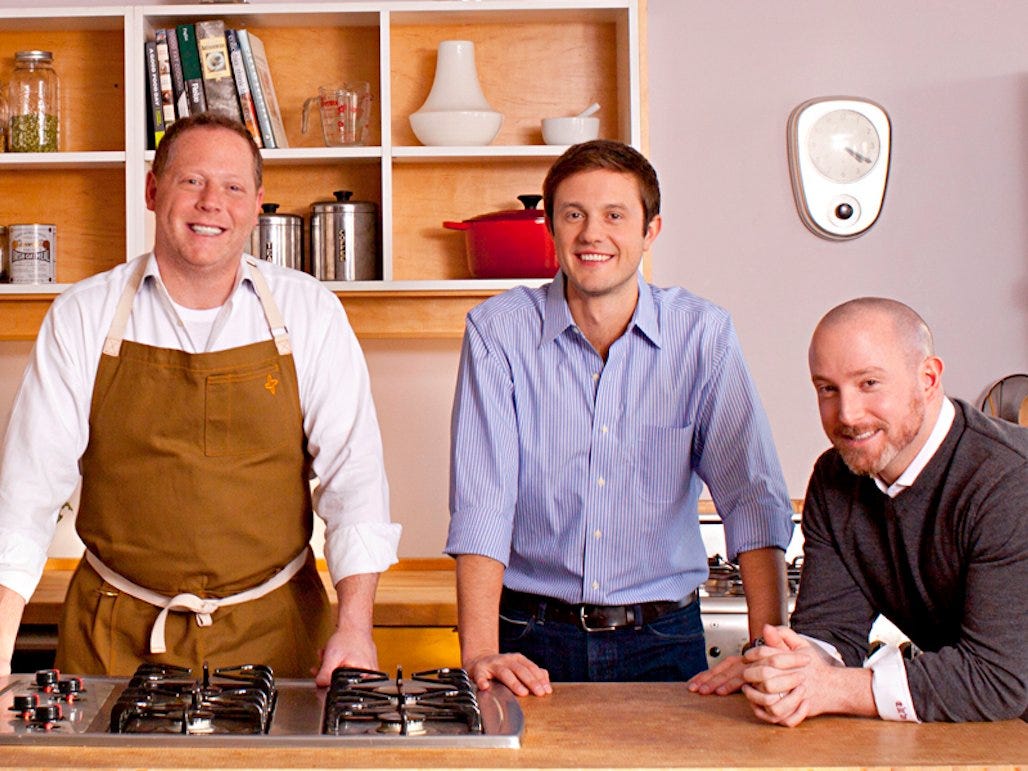 Hungryroot co-founders Franklin Becker, Ben McKean and Gregory Struck gathered behind a kitchen counter