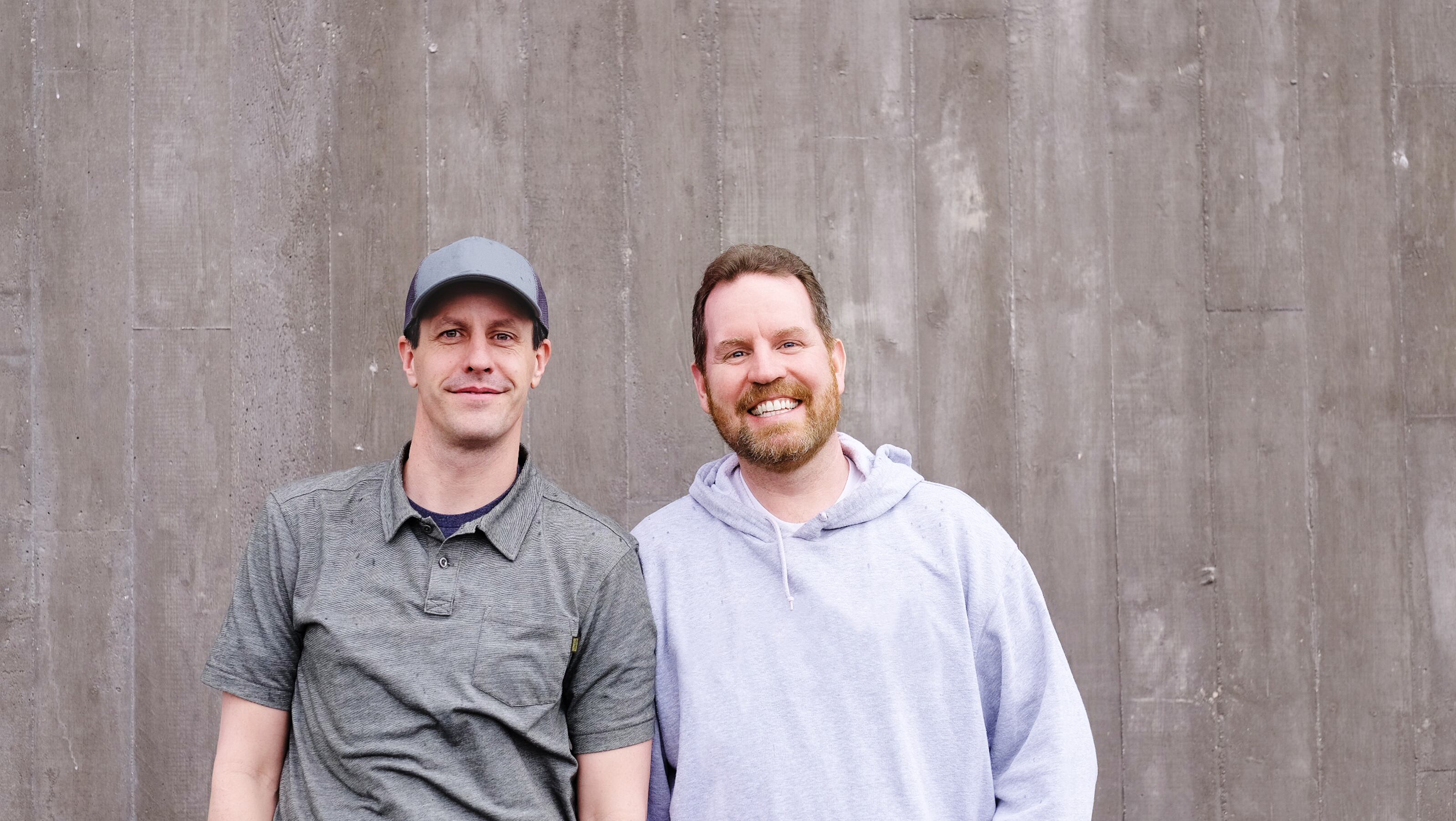 Ben Peterson, wearing a baseball cap, alongside BambooHR co-founder Ryan Sanders