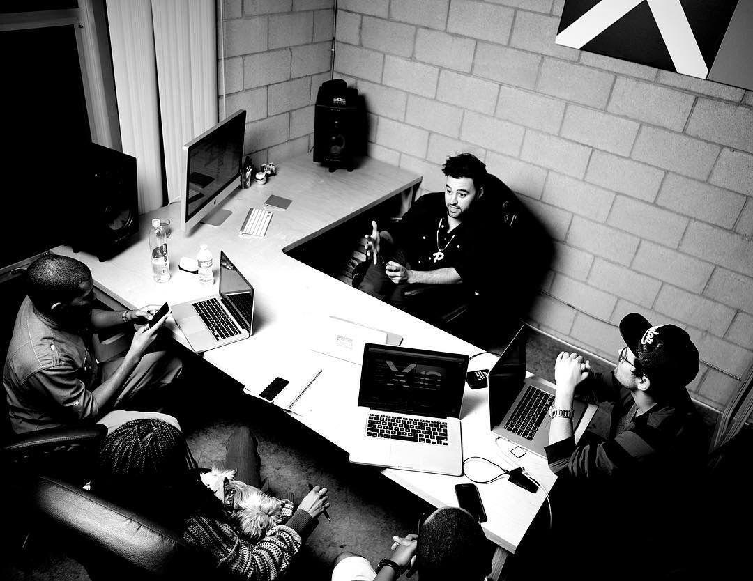 Ben Ricciardi and colleagues working around desks in the early basement office