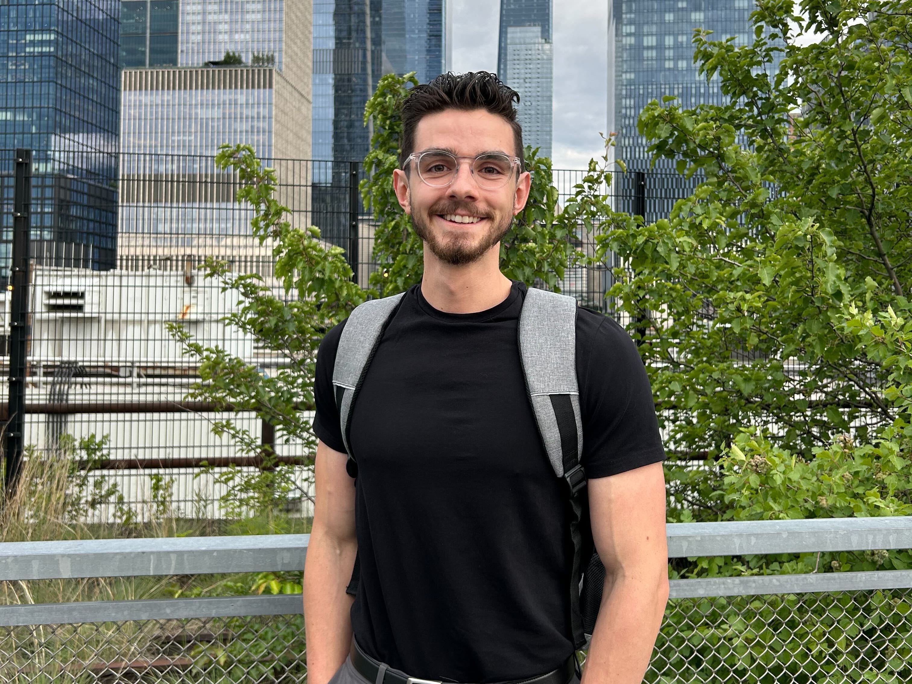 Ben Spray wearing glasses and a backpack at New York Tech Week