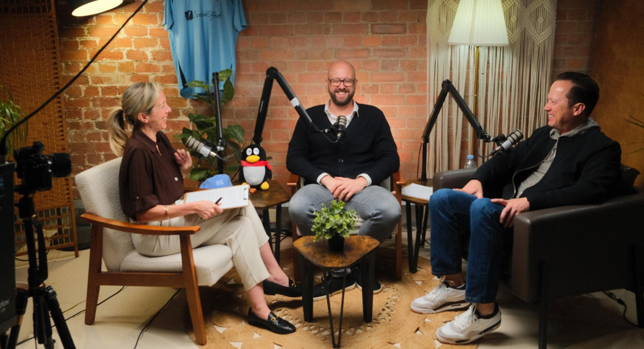 Berkley Egenes, right, speaking with two hosts during a Good Game Club podcast recording