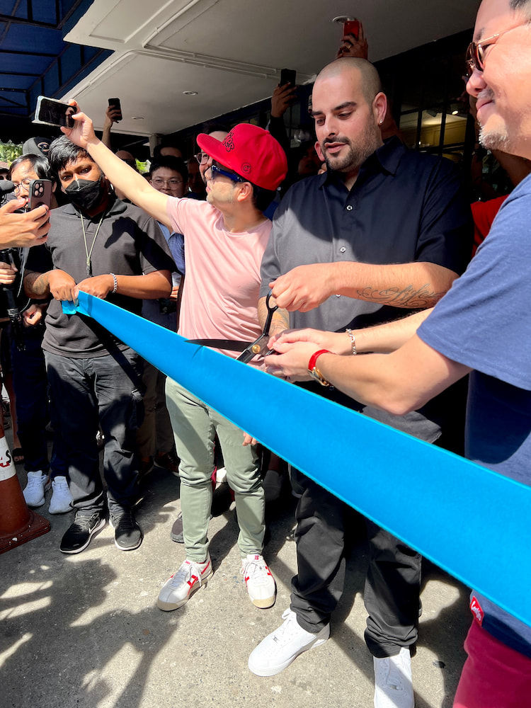Berner and a local partner cutting the ribbon at the Cookies Bangkok opening