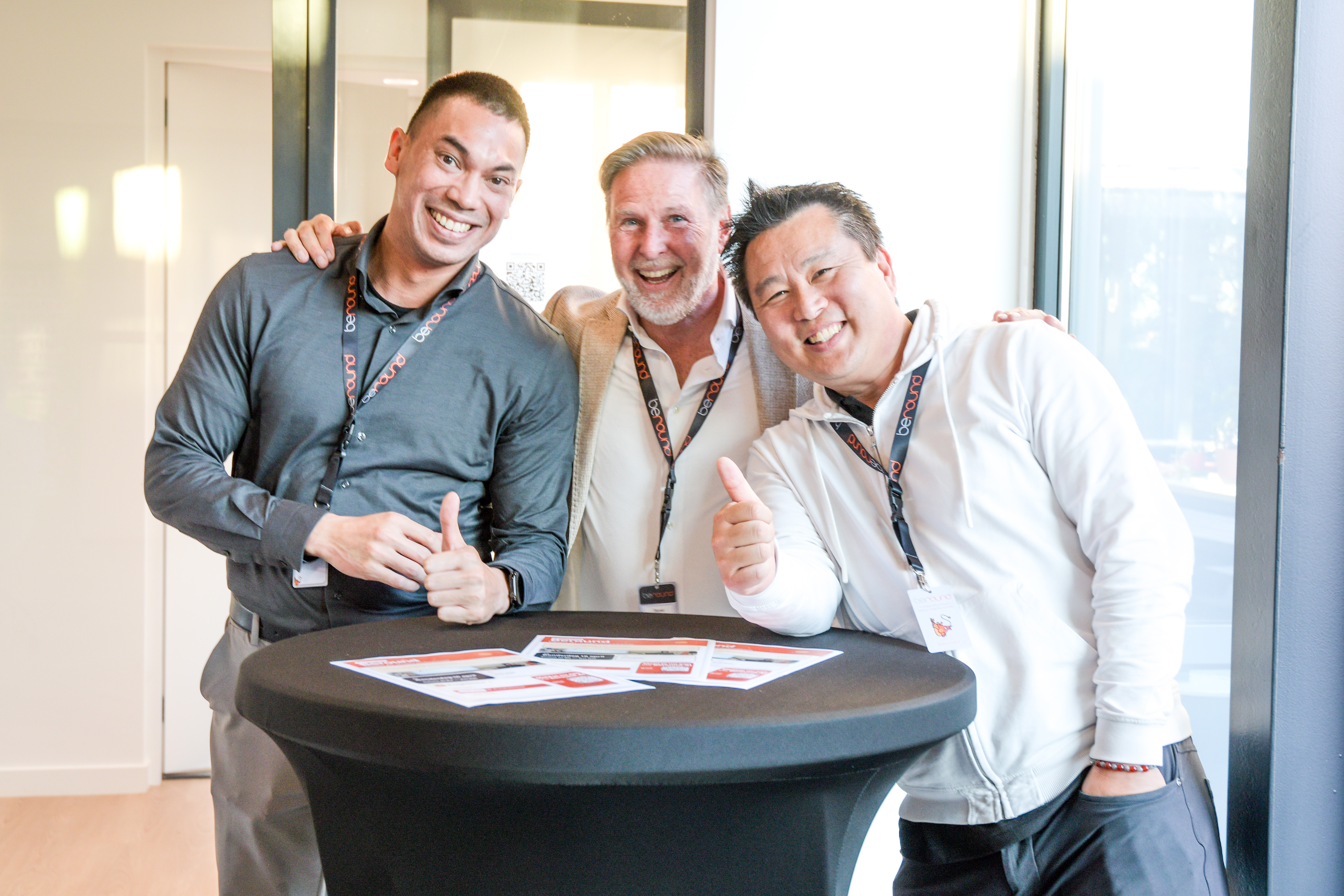 Three Beround colleagues smiling at a company gathering