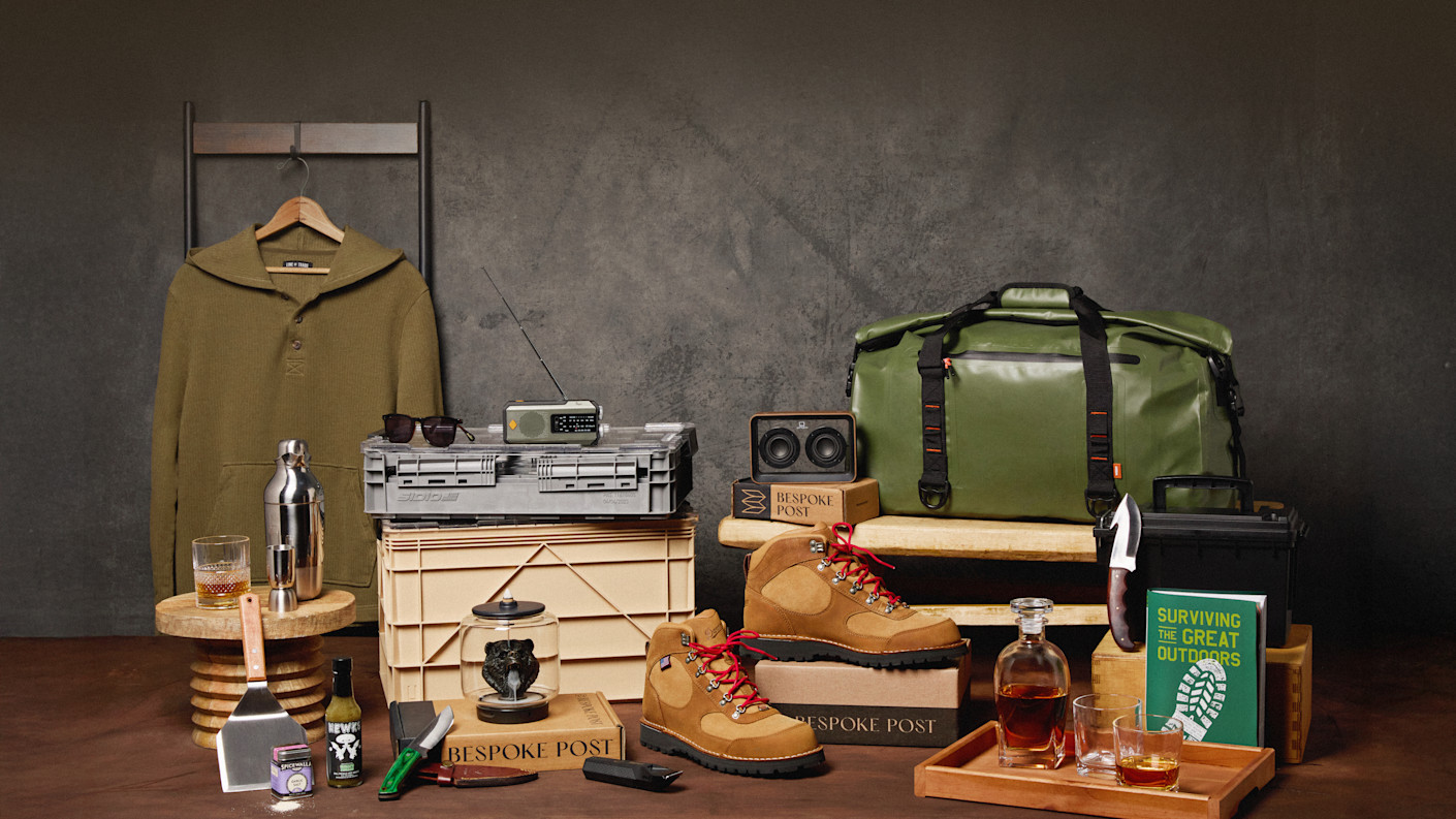 Bespoke Post assortment including a jacket, a duffel, barware, an outdoor stove and travel goods