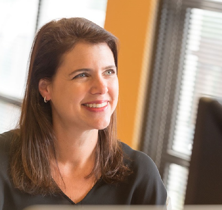 Bethany Andell smiling in an office setting