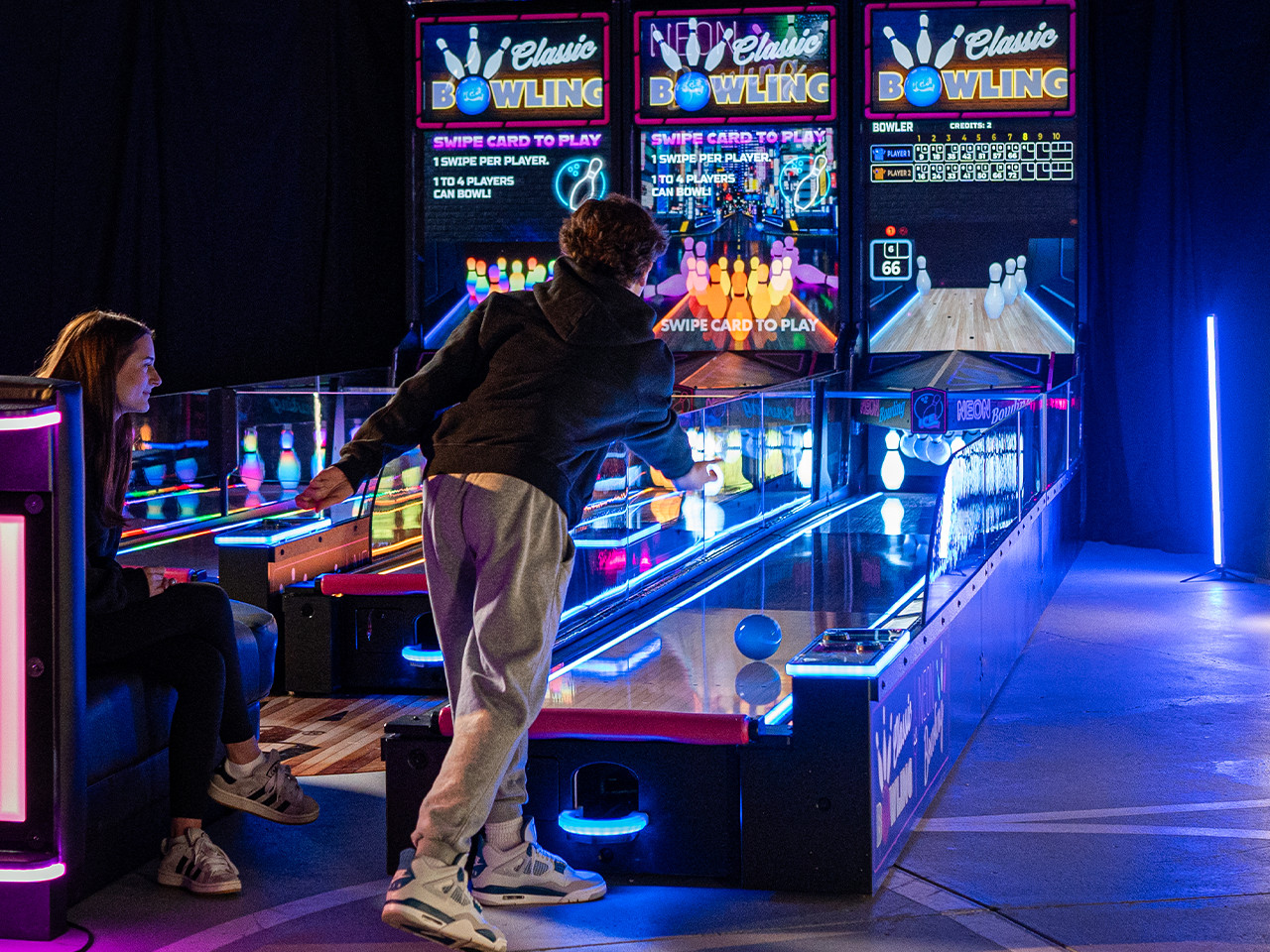 Neon-lit bowling and entertainment venue
