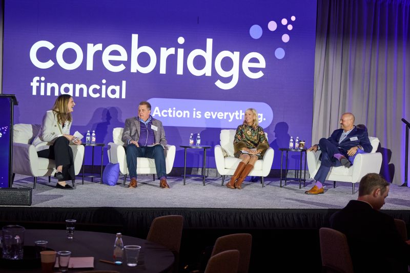 Betsy Palmer and Corebridge Financial colleagues participating in a retirement services panel on a conference stage