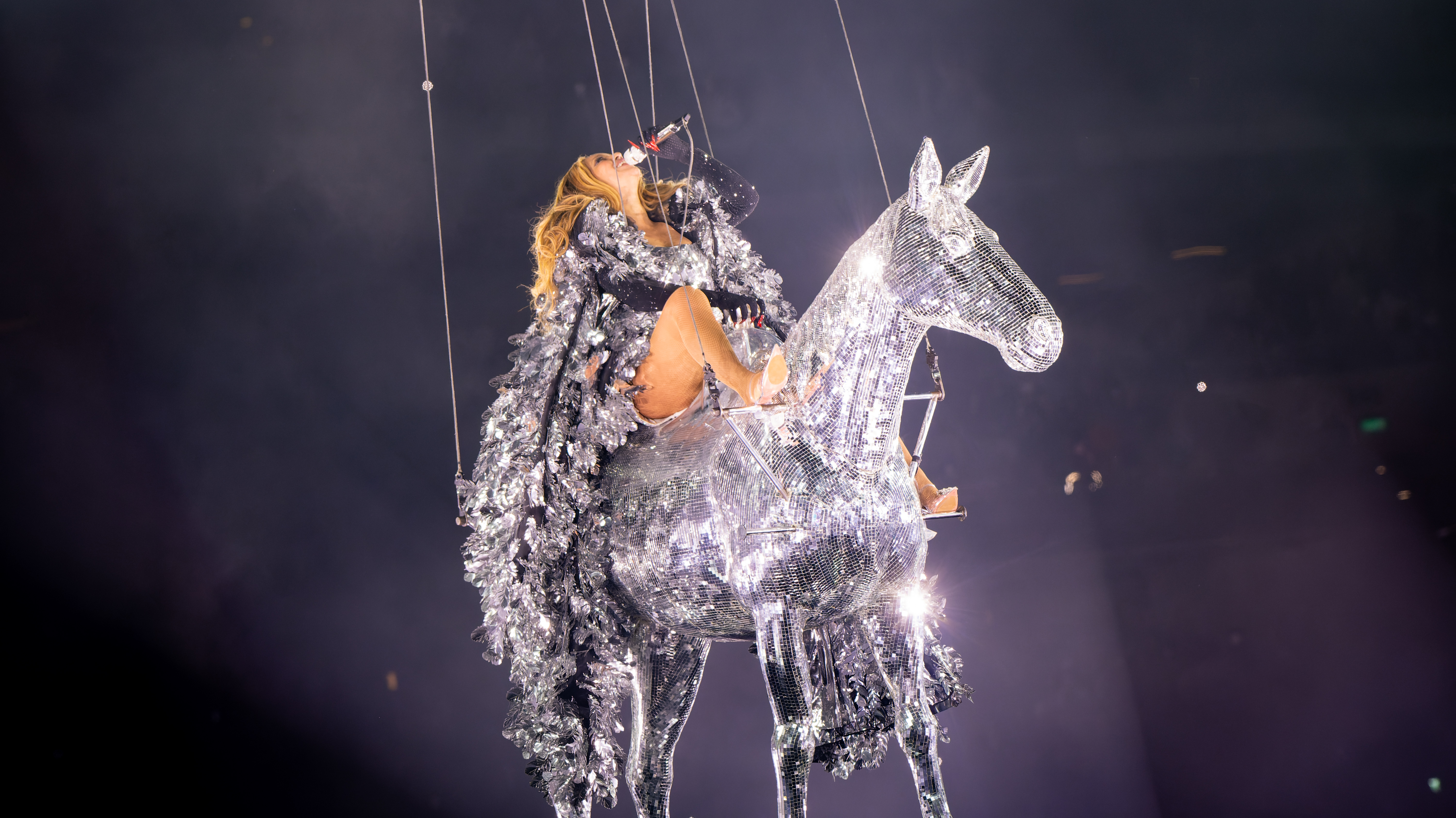 Beyoncé performs under stage lights during the Renaissance World Tour in London in 2023