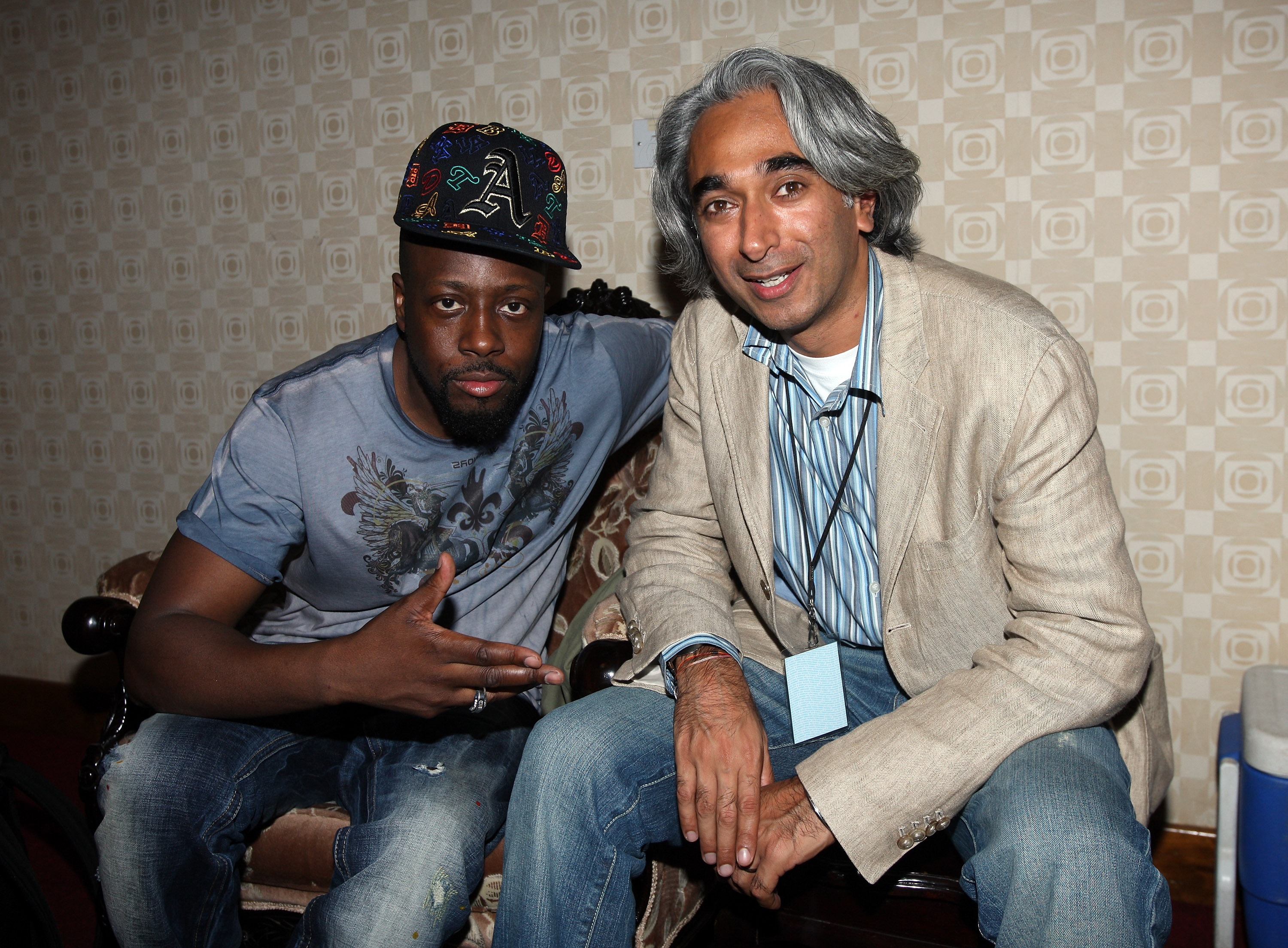 Bhav Singh, right, sitting with Wyclef Jean at the 2009 MTV Africa Music Awards