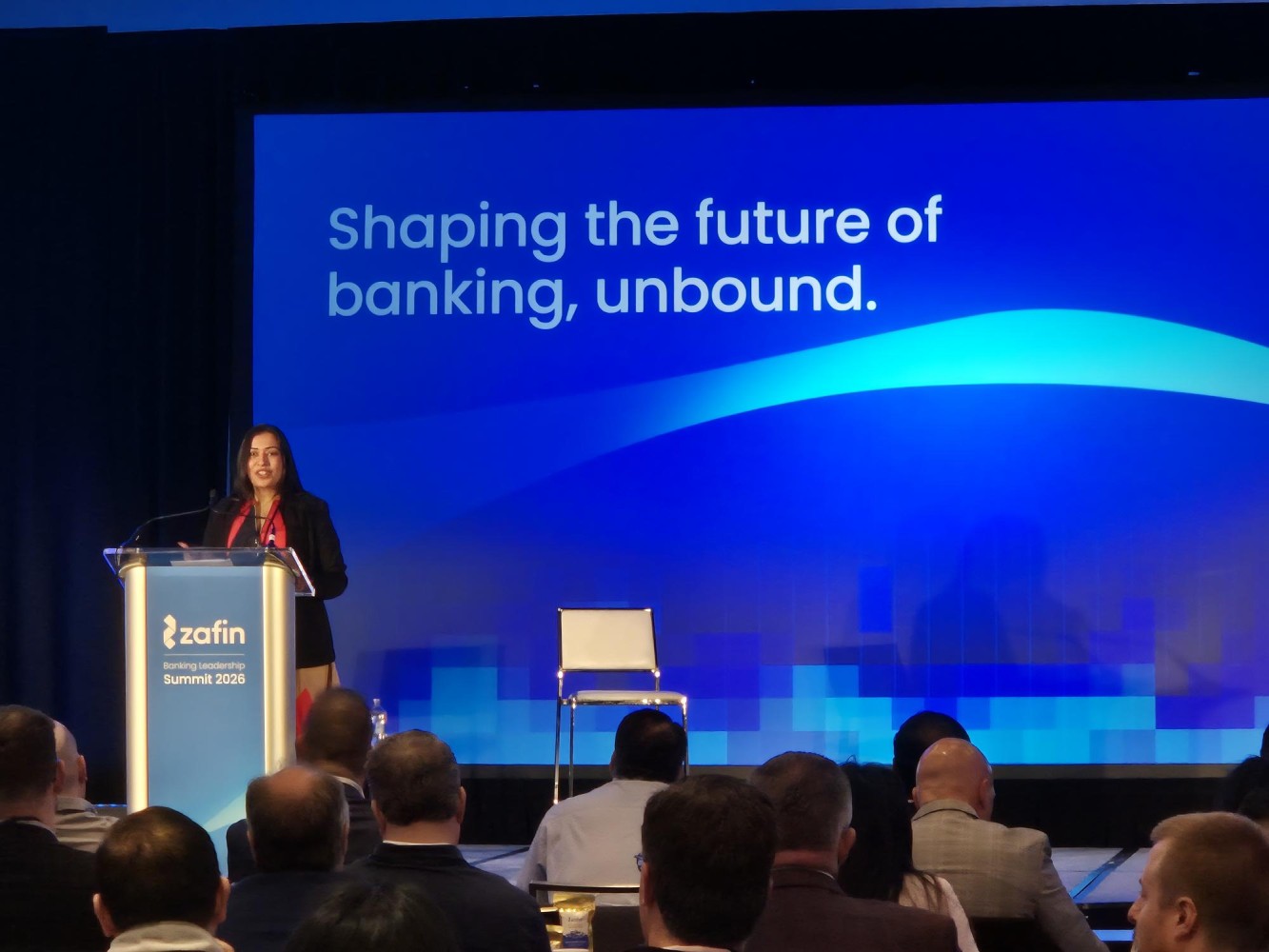 Bhavna Wadhwa speaking from a lectern at Zafin's Banking Leadership Summit 2026