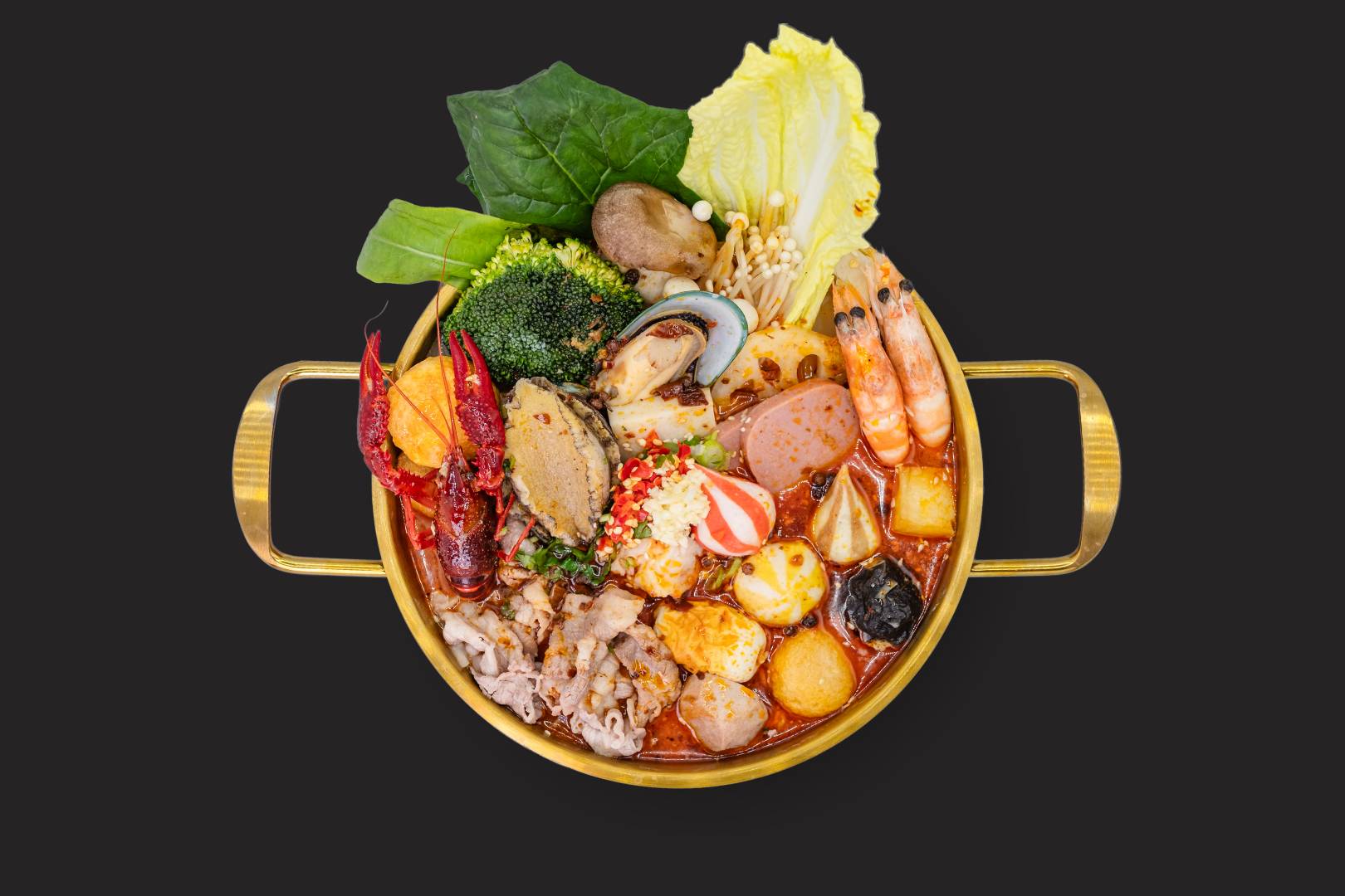 A Big Way Hot Pot signature mala bowl crowded with seafood, vegetables, meat, mushrooms and tofu in a gold pot