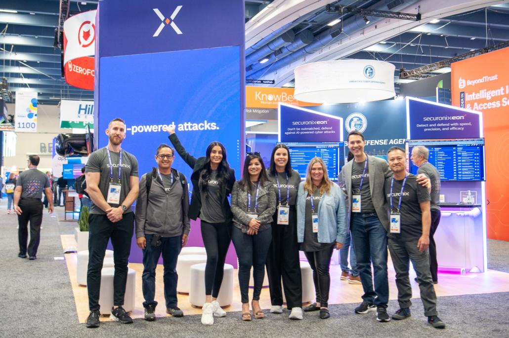 The Securonix marketing team standing together at its RSA Conference 2024 booth