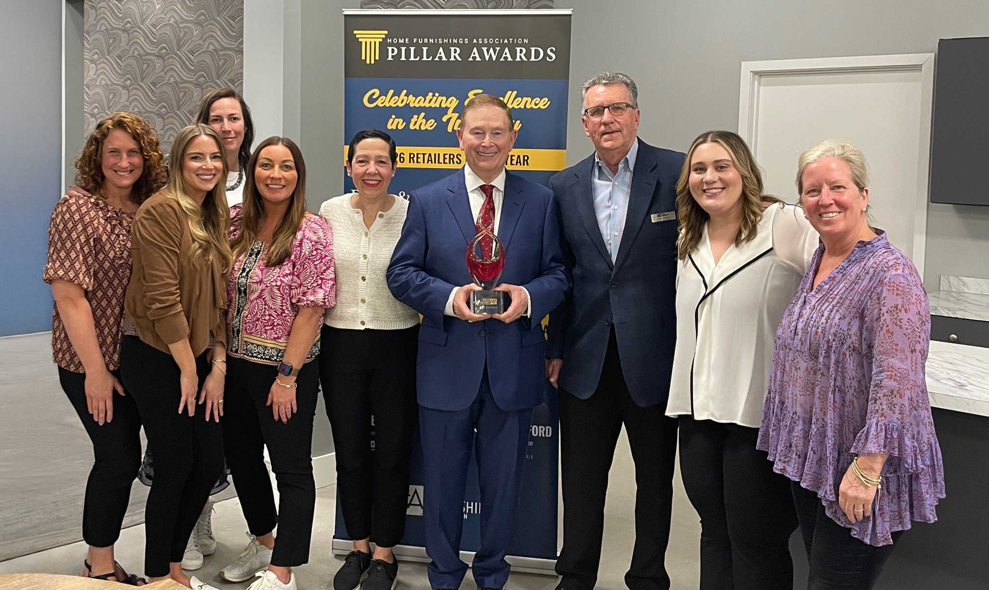 Bill Barton celebrates with his buying team and Peter Theran at the HFA awards reception
