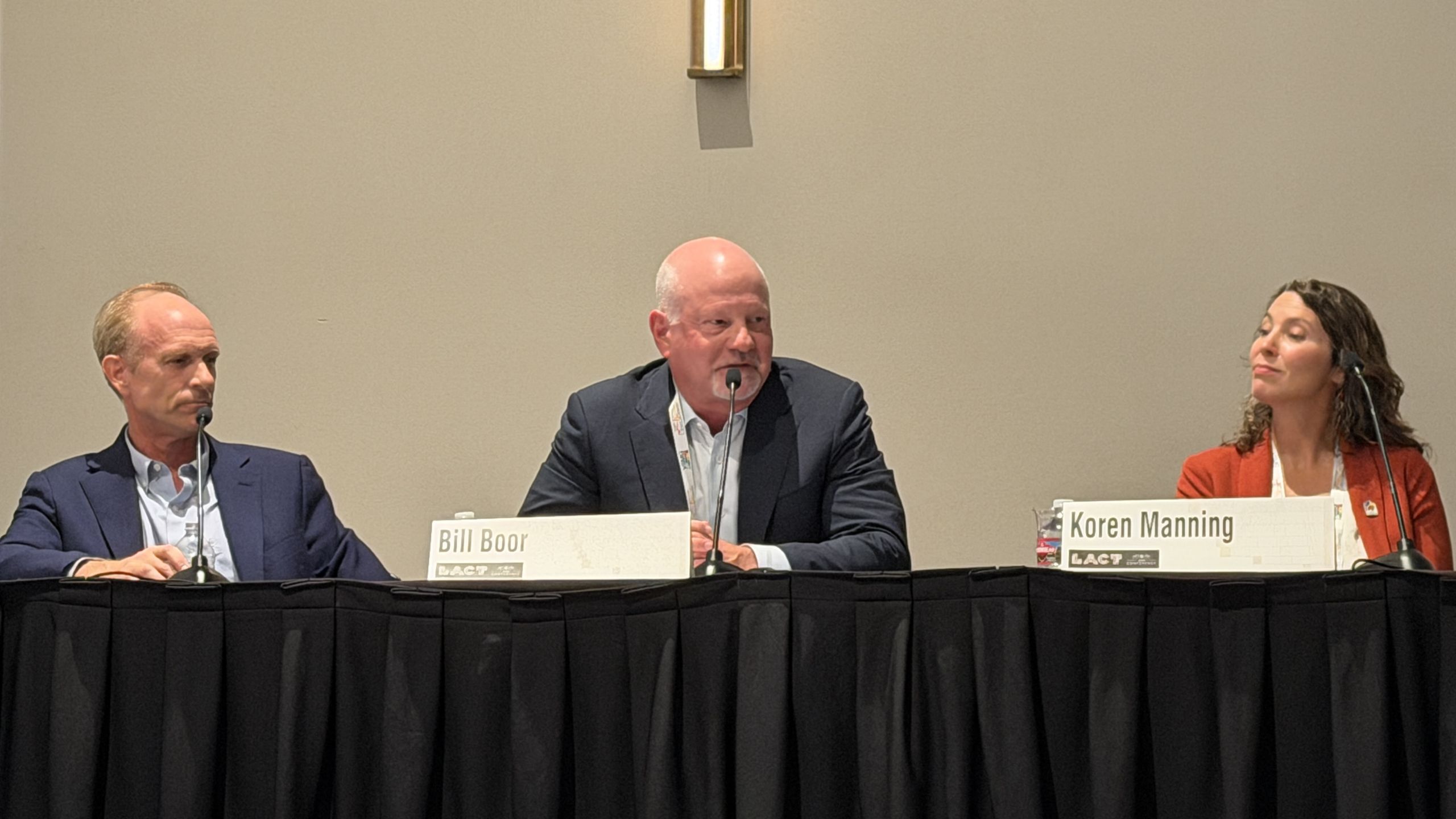 Bill Boor, seated at the center of a panel, speaking into a microphone at the 2026 League of Arizona Cities and Towns conference.