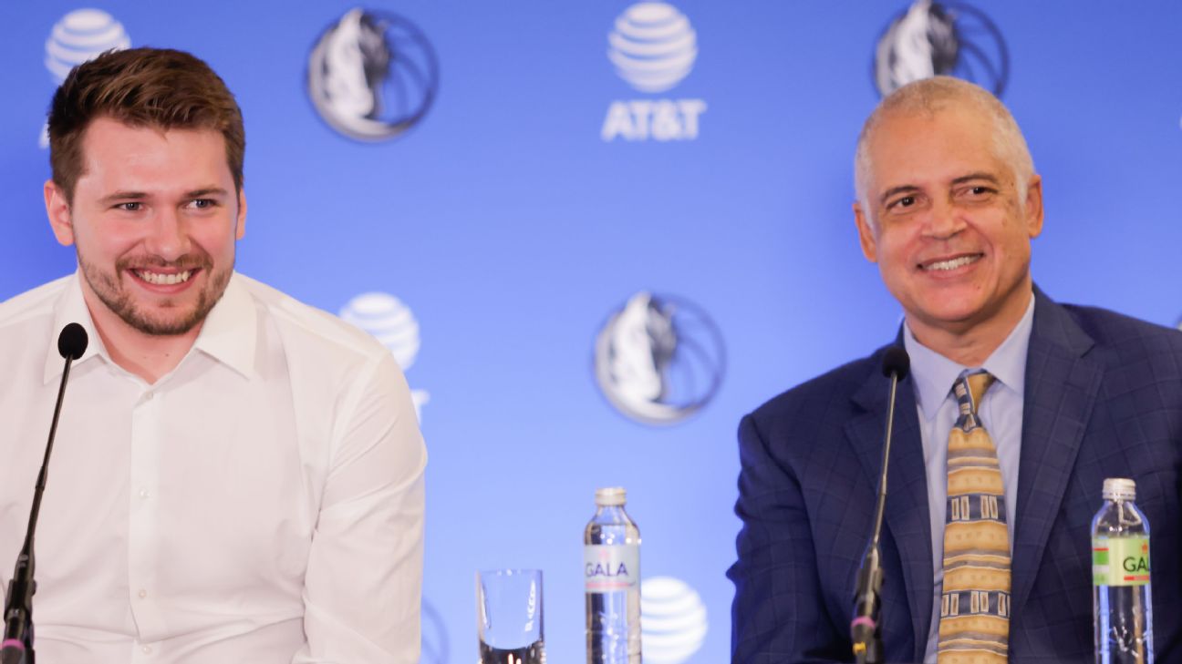 Luka Dončić and Bill Duffy smiling at a Dallas Mavericks press conference