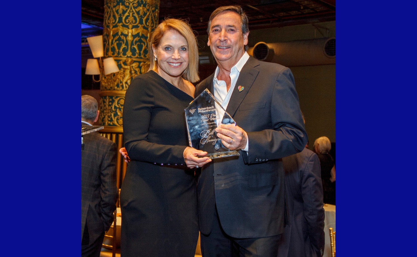 Katie Couric and Bill Koenigsberg holding his Reisenbach award at a benefit