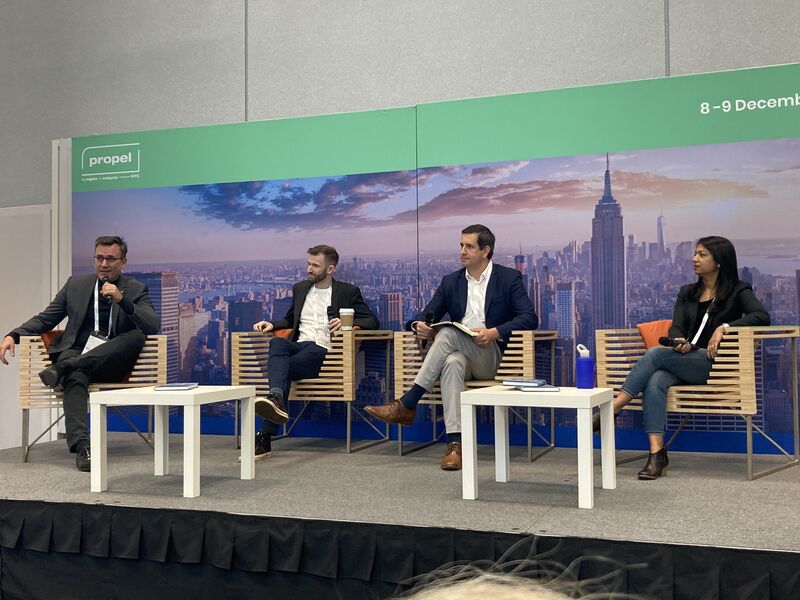 Four panelists seated onstage at Propel by MIPIM in December 2021