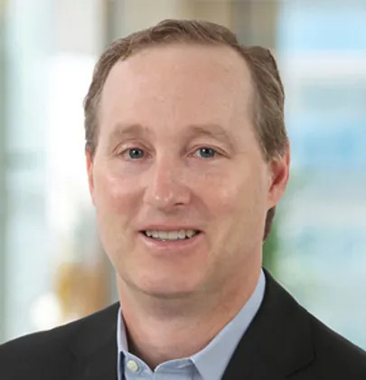 Bill Stapleton in an earlier professional portrait