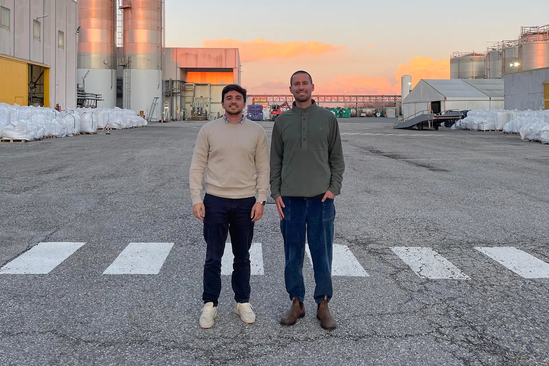 Eduardo Santos and Billy McCall standing at the Selenis manufacturing site in Italy