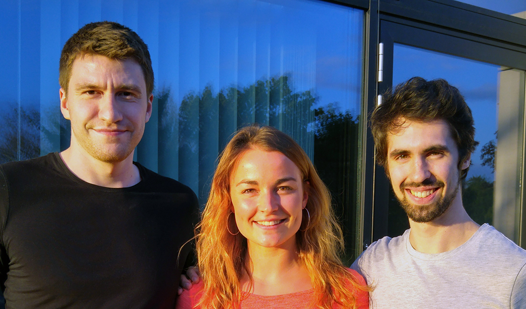 Nuclino’s early three-person founding team standing together outside a building