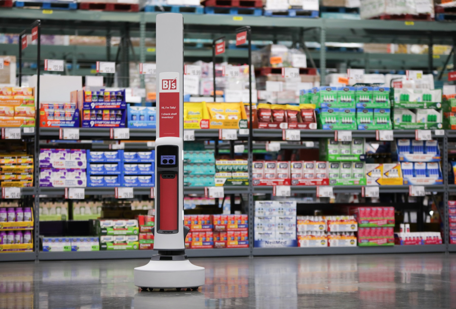 Tally shelf-scanning robot in a BJ’s aisle stocked with household products