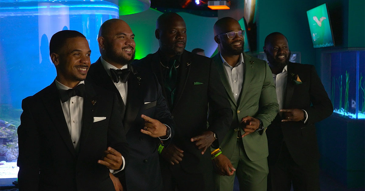 Five men gathered at an evening event in a photograph published with Black Digital's founder story