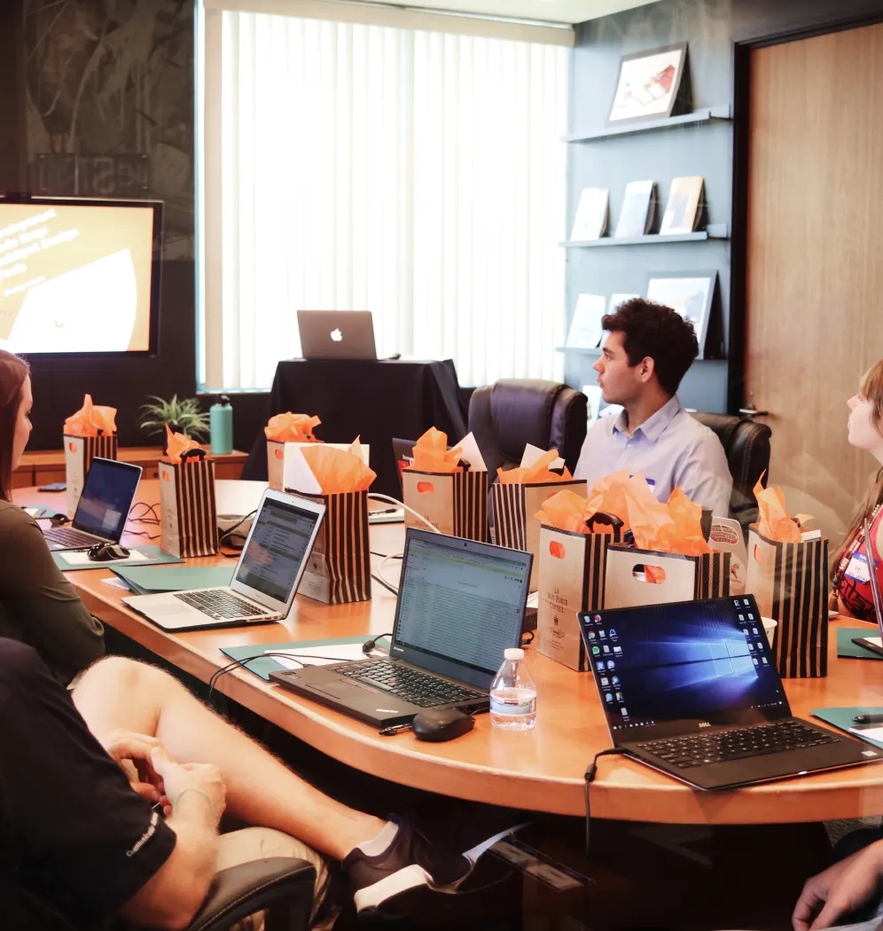 Altiam CX staff in a company workplace photograph
