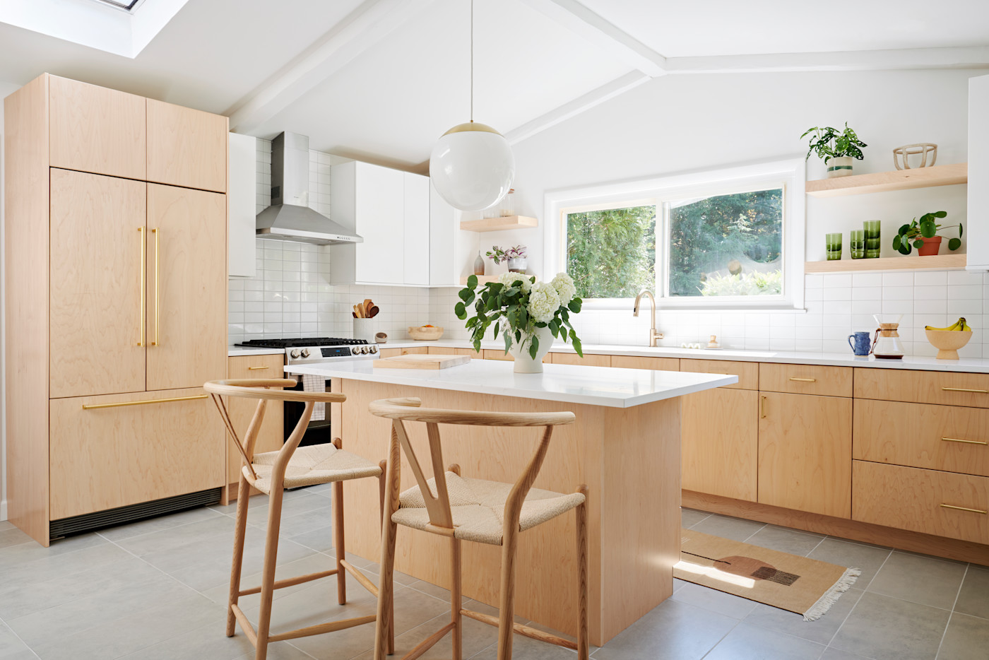 Kitchen renovation executed by Block Renovation, with cabinetry and island seating
