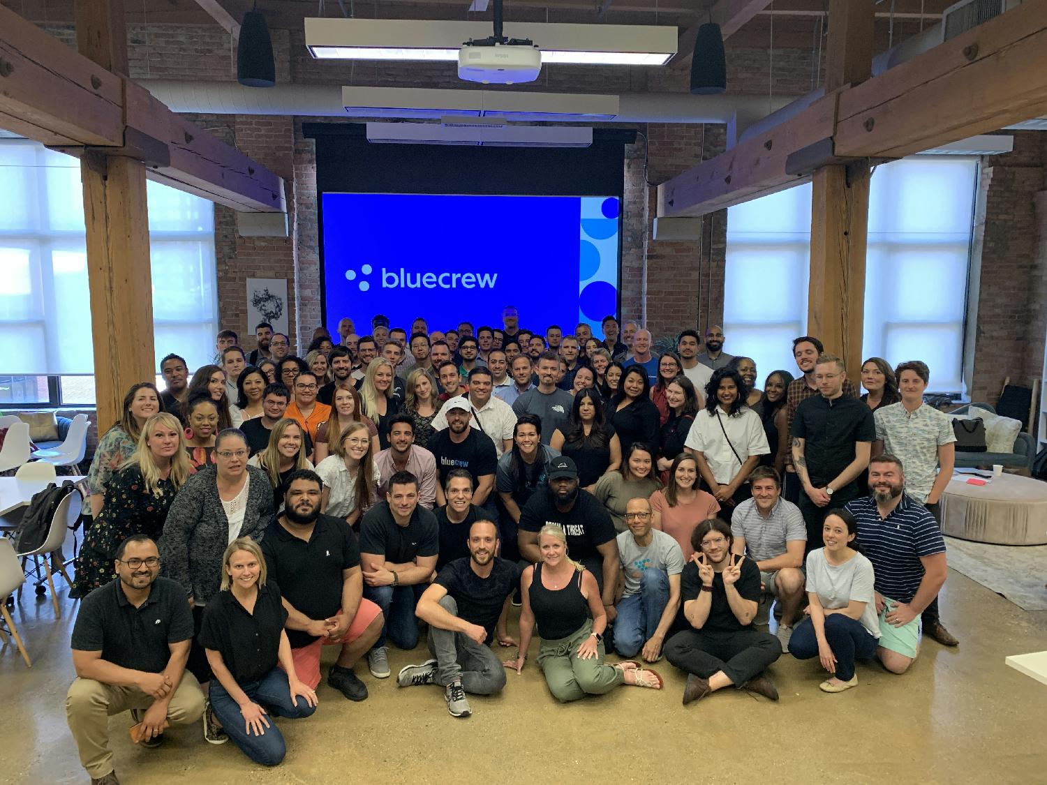 Bluecrew employees gathered for a historical team photograph