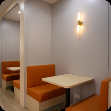 Orange upholstered seating booths in BlueVenture’s office