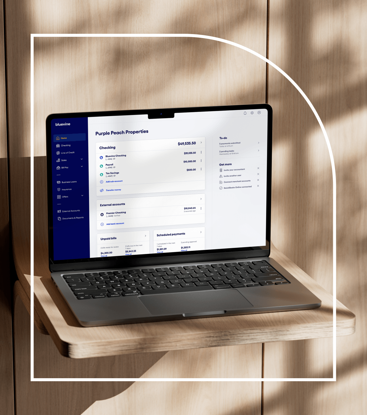 Bluevine dashboard on a laptop, showing checking, payroll and tax sub-accounts and scheduled payments