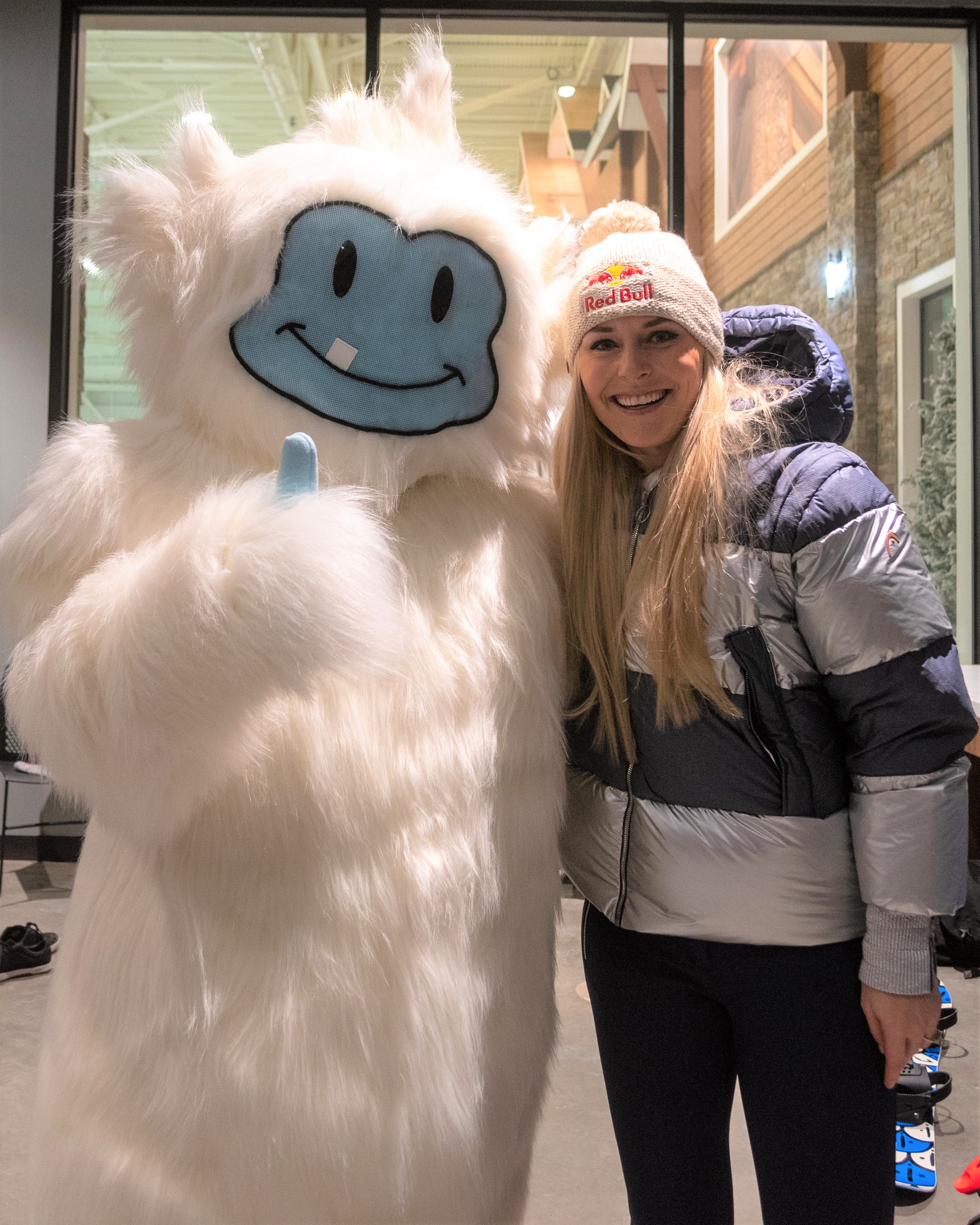 Olympic skier Lindsey Vonn posing with the Big SNOW mascot at the indoor ski destination