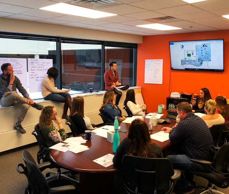 BML Public Relations team members in a conference-room workshop