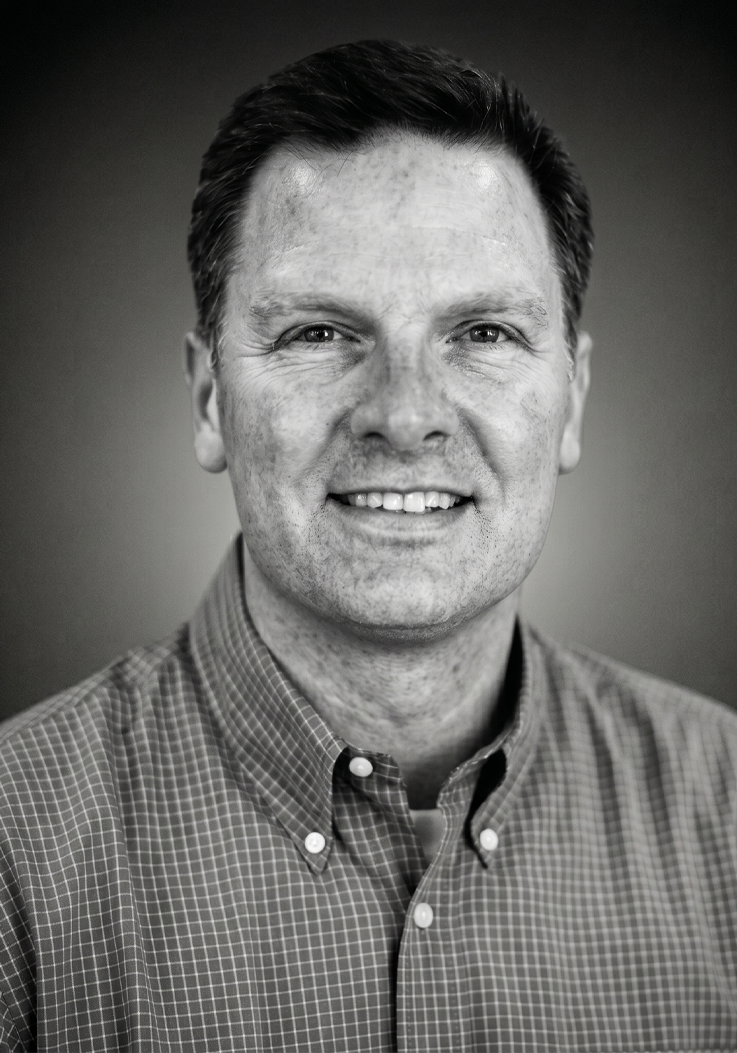 Black-and-white portrait of Boathouse co-founder Chris Boland