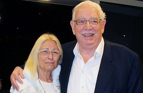 Varda and Boaz Dotan standing together, Boaz with his arm around Varda.
