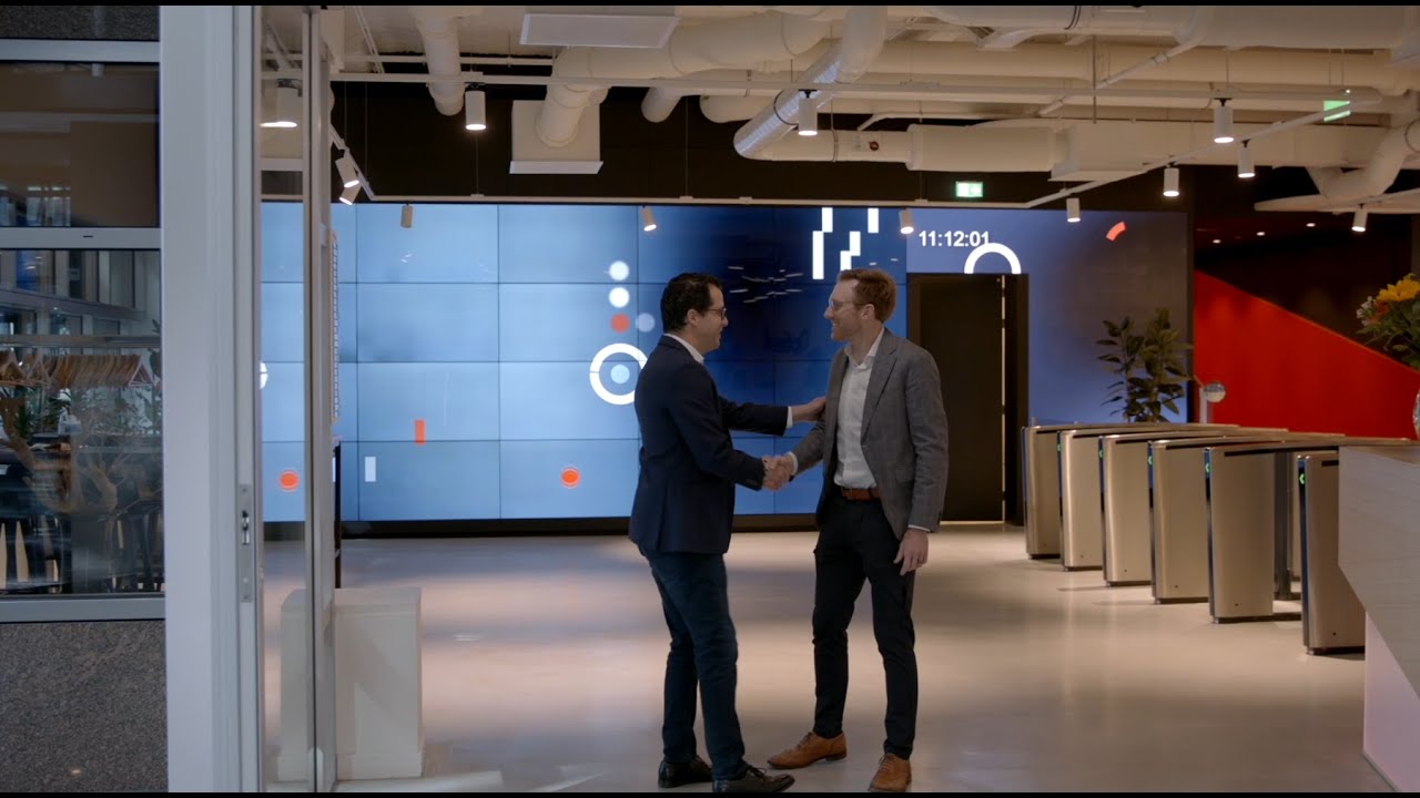 Boaz Yaari, left, greeting a host at Optiver’s Amsterdam headquarters