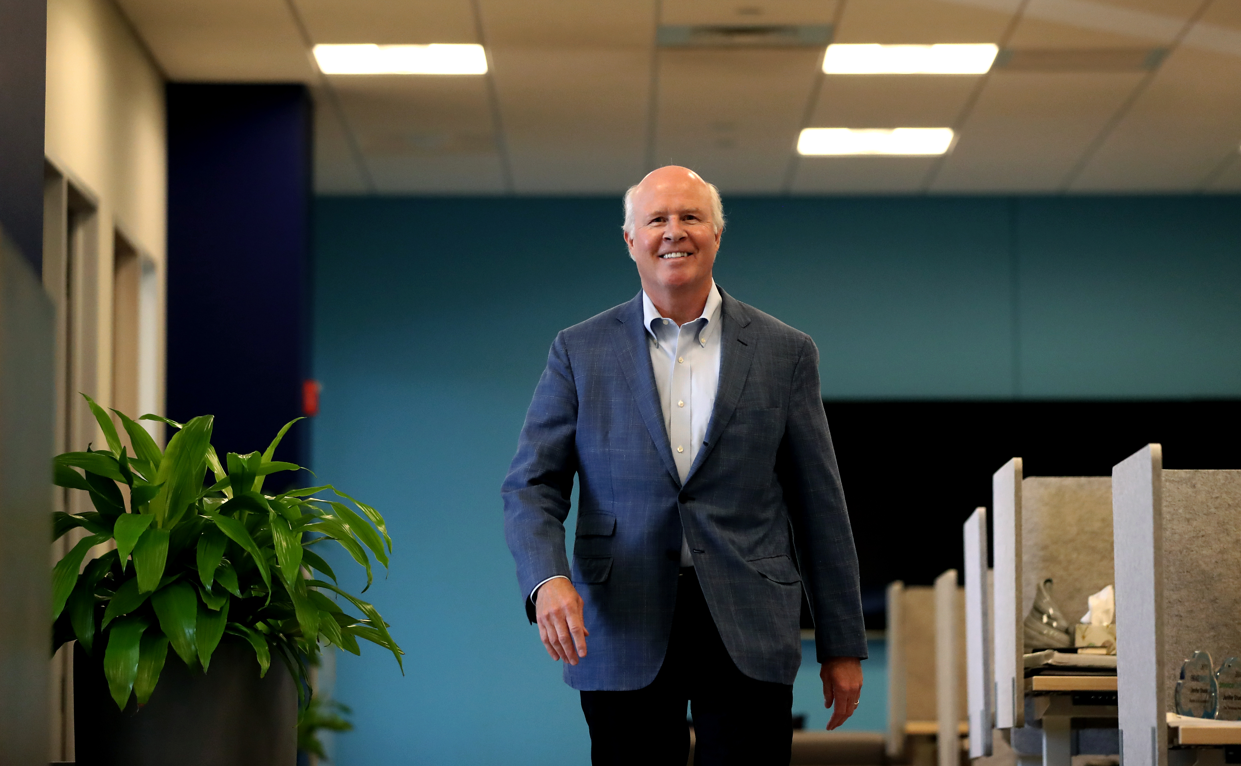 Bob Bennett walking through EngageSmart's Braintree office