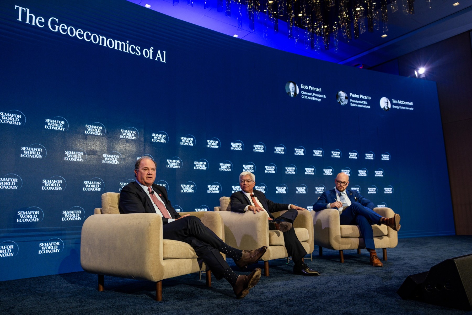 Bob Frenzel, left, speaks on a Semafor World Economy panel with Pedro Pizarro and Tim McDonnell.