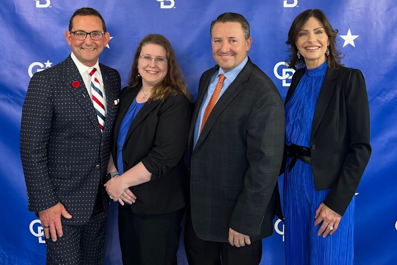 Bob Hamrick, Crystal Brown, Matt Mullin and Molly Hamrick standing together at Coldwell Banker