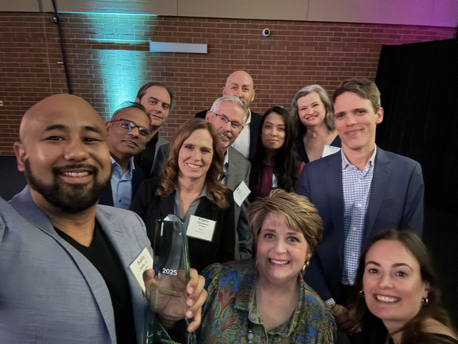 Bobby Reddy Jr. taking a group selfie with the Prenosis team at the 2025 Chicago Innovation Awards