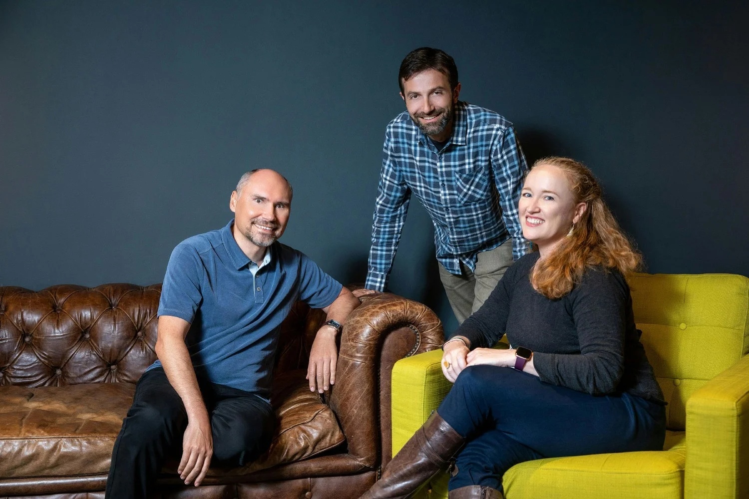 Wisetack co-founders Mykola Klymenko, Bobby Tzekin, and Liz O’Donnell together in an office lounge