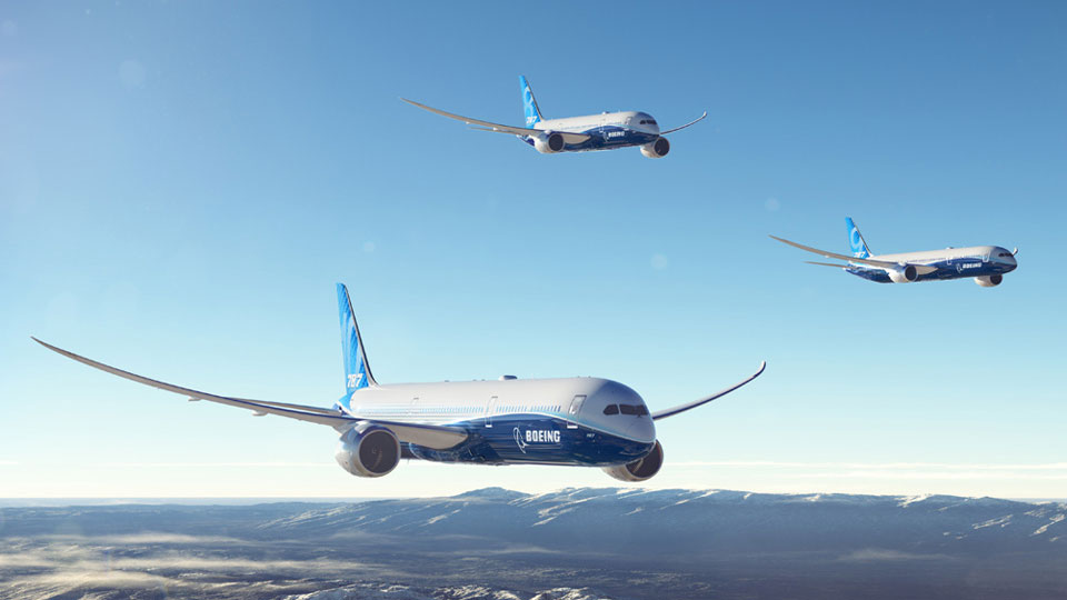 Boeing promotional image showing three 787 Dreamliner variants above a mountain landscape