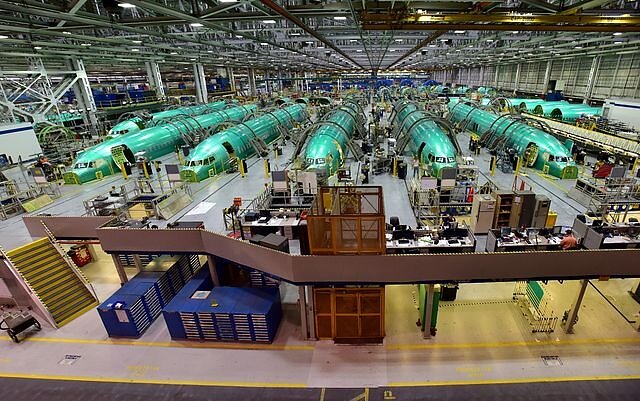 Rows of green 737 fuselages inside the Wichita production facility