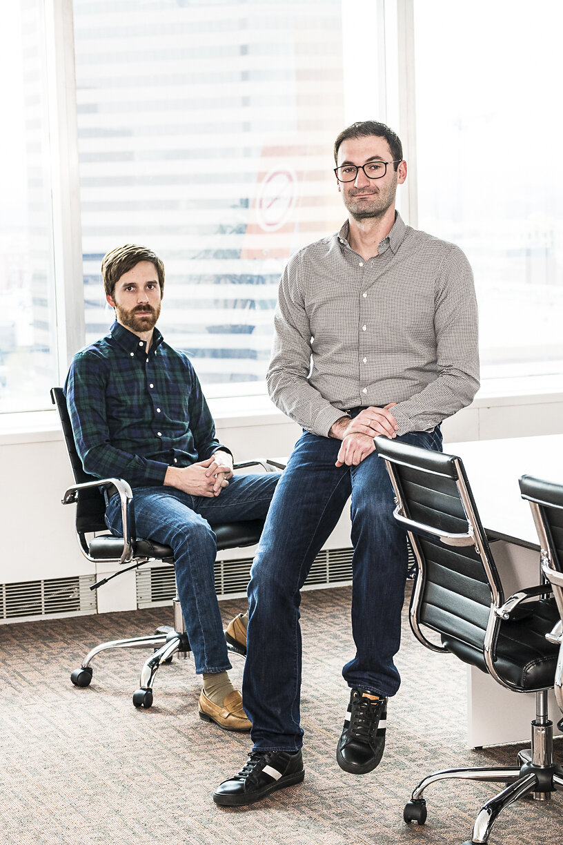 Bold Penguin co-founders Ben Clarke, seated at left, and Ilya Bodner, at right, in a 2019 press photograph