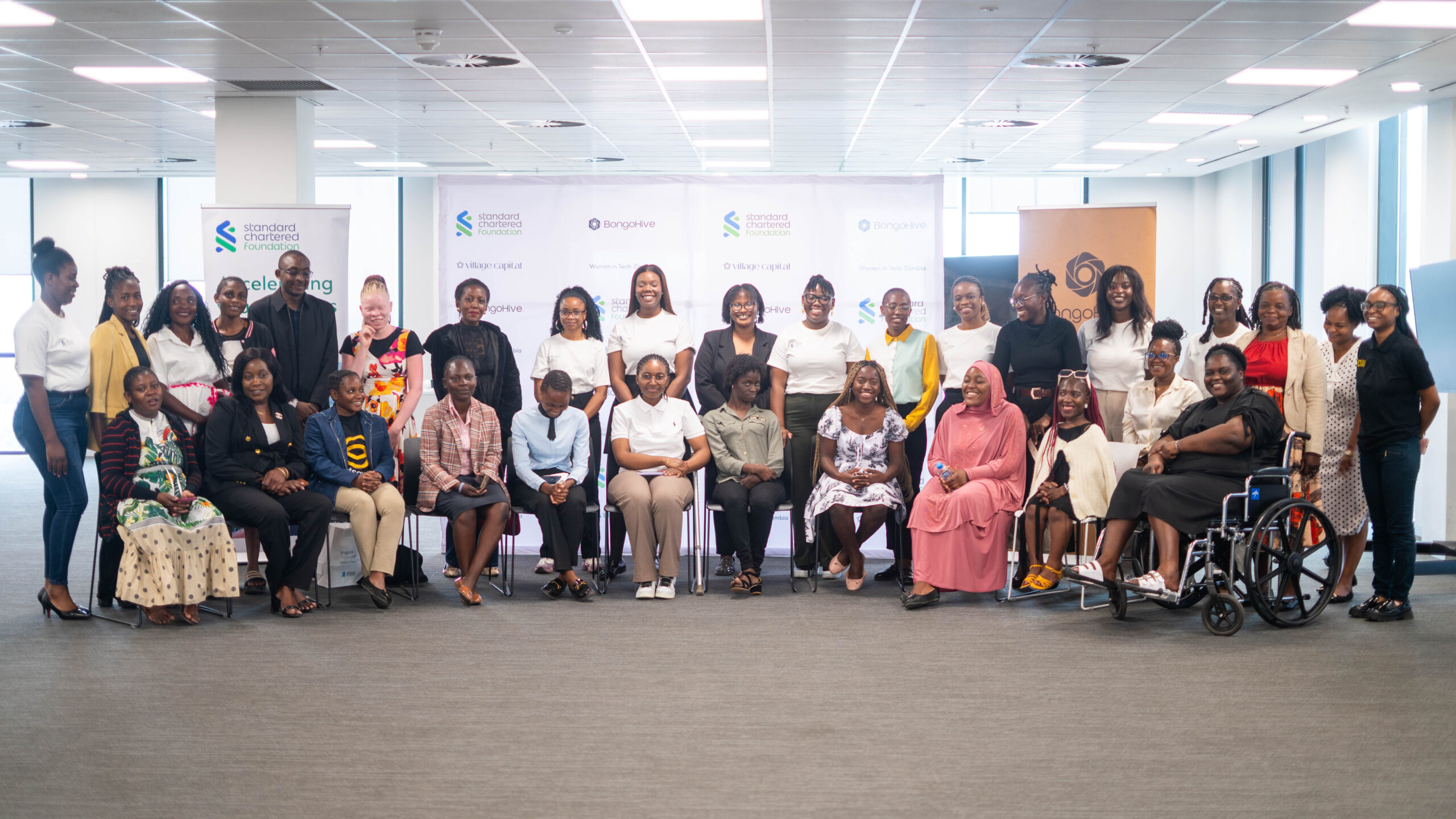 Women in Tech founders and accessibility workshop participants gathered for a group photograph in Lusaka