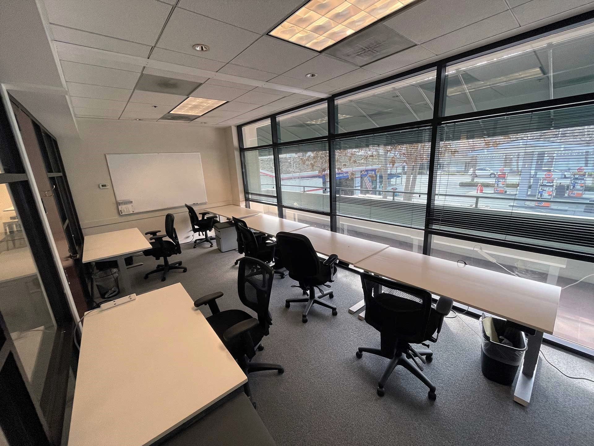 Desks and chairs in a windowed BootUP workspace