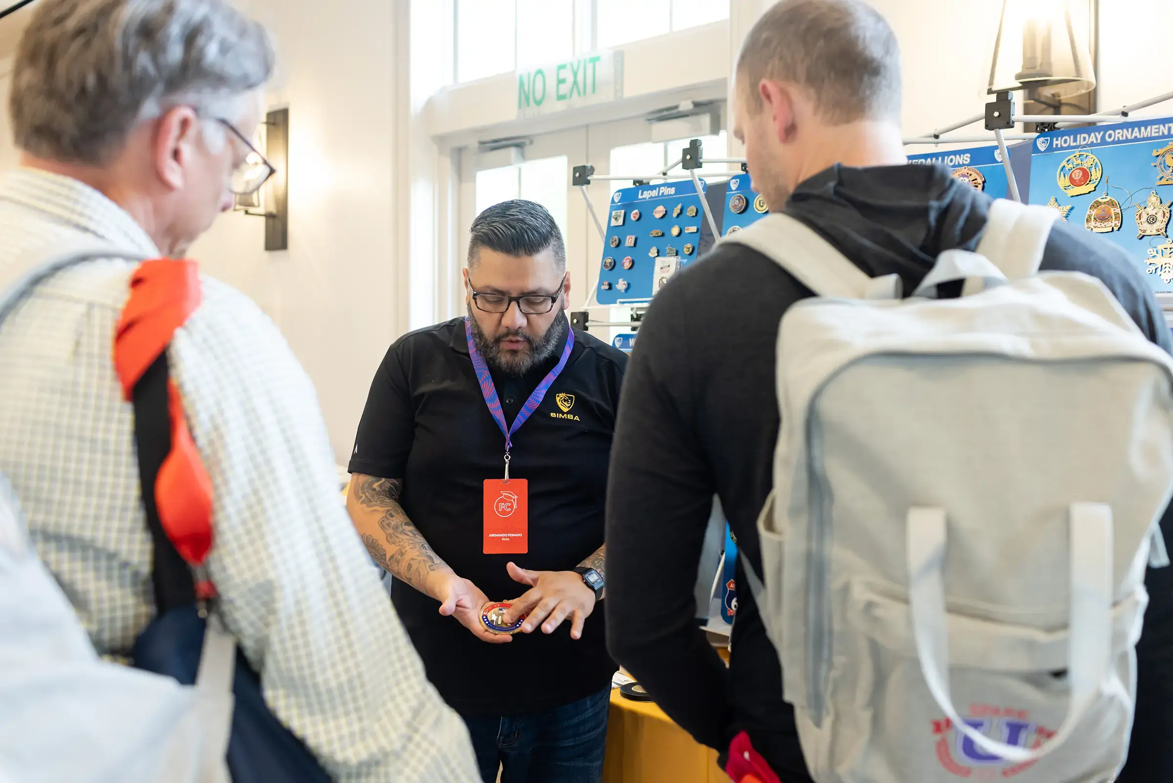 A supplier showing promotional product samples to visitors at a Boundless event