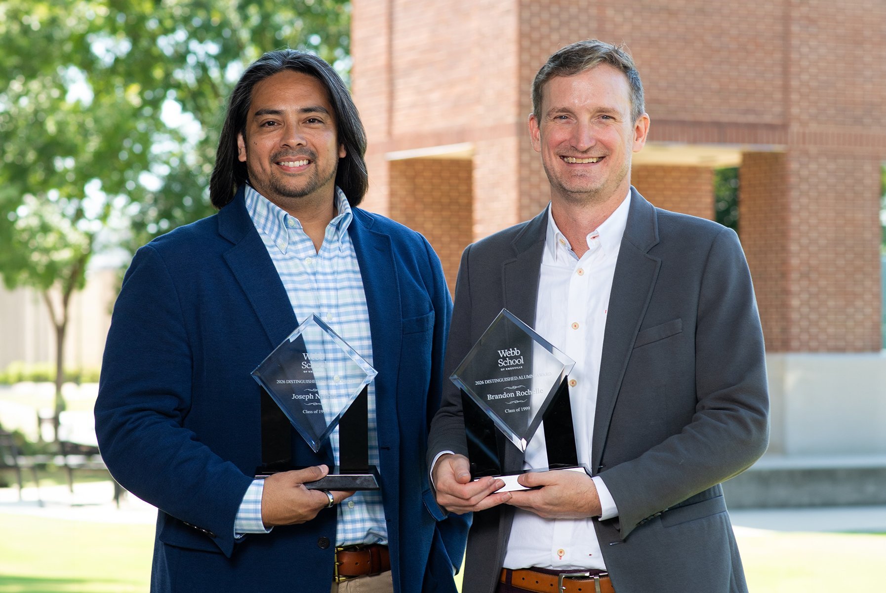 Joseph Nother, left, and Brandon Rochelle, right, holding their Webb School Distinguished Alumni awards
