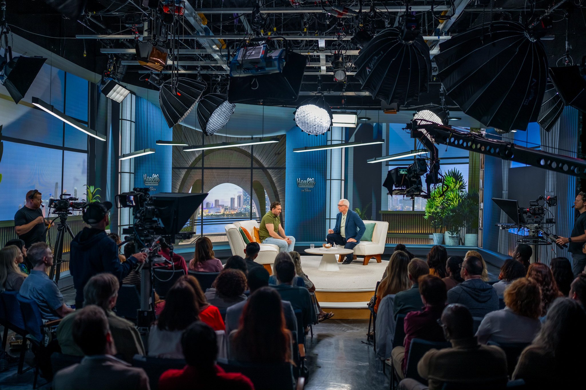 Camera crews and a seated audience during a production at BrandStar Studios