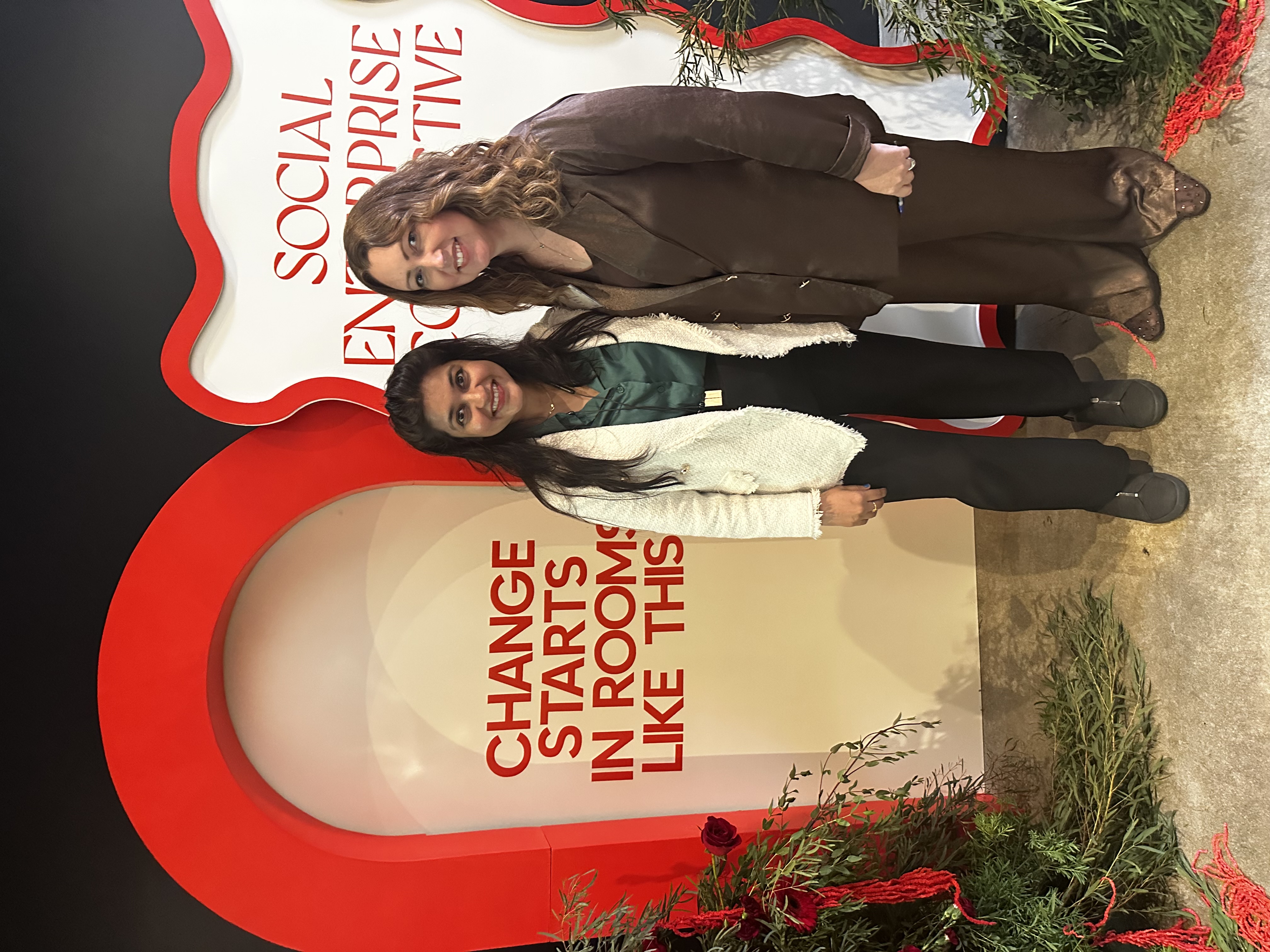 Harsha Saxena and Bree Jensen standing together at the Social Enterprise Collective